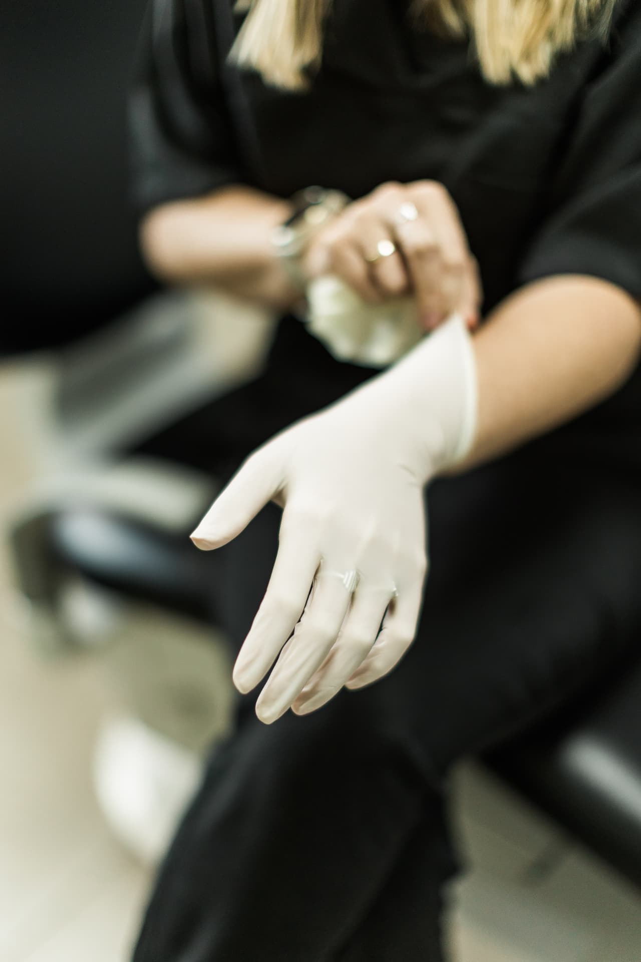 Sterile gloves being put on ahead of a periodontal treatment